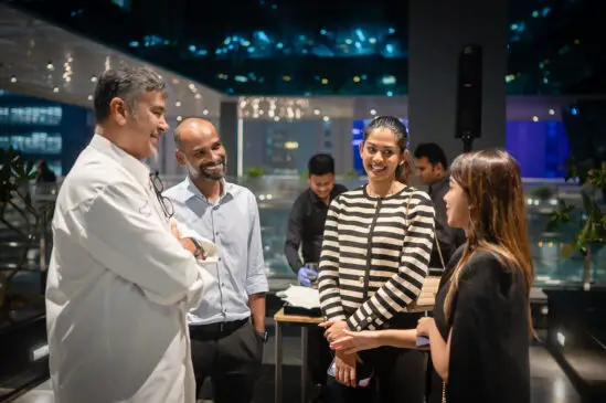 Pramod and Chef Shankar with guests at a Chef's table